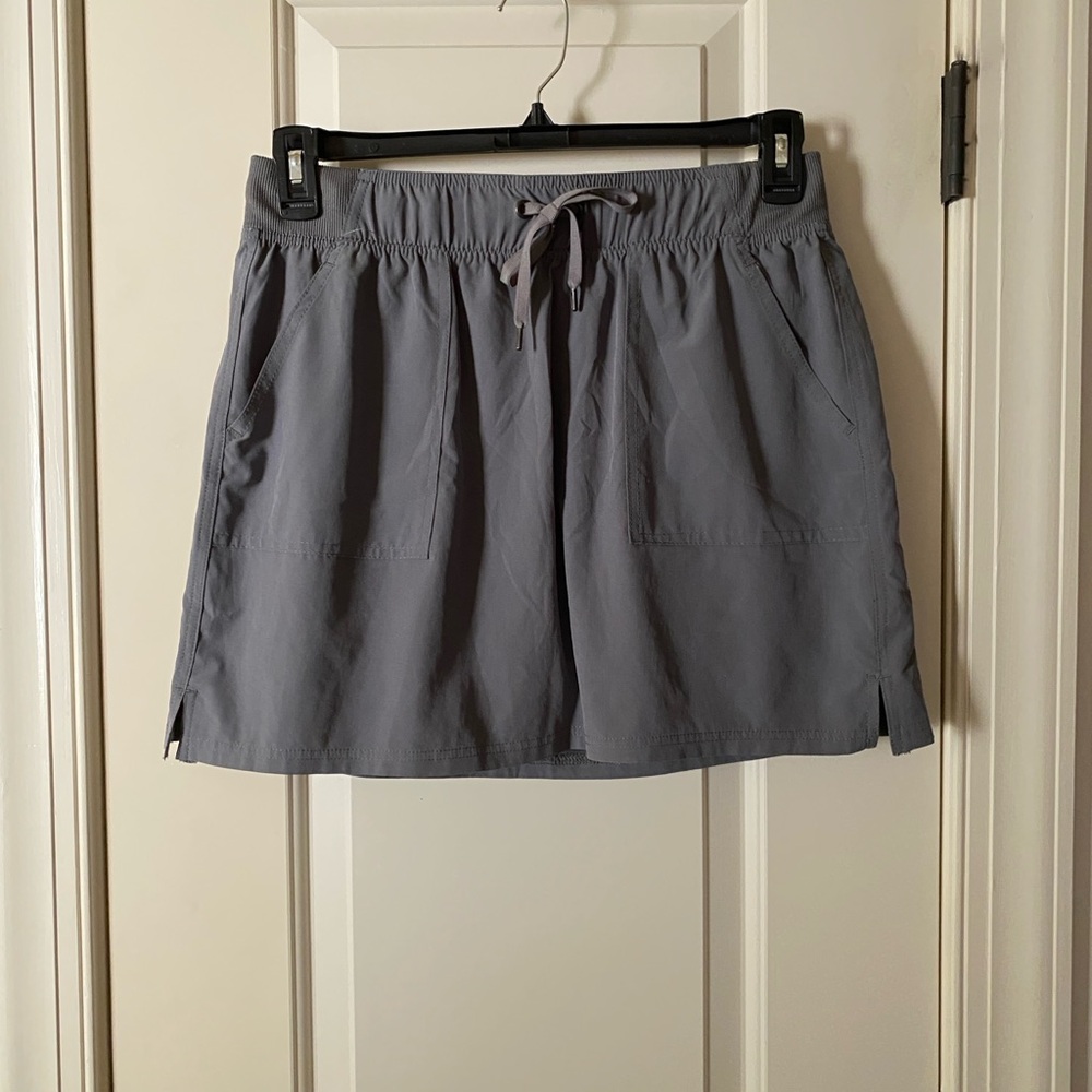 Champion green/gray sport skort.  Tag says L but fit is M. Super light worn once